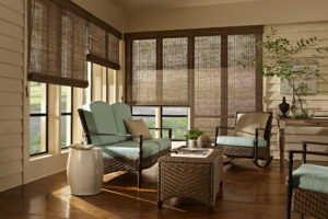 Woven wood shades on living room windows.