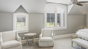 White plantation shutters on bedroom windows.