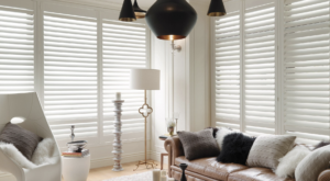 White plantation shutters on large windows.