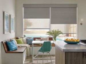 Grey blackout shades on large dining room and kitchen windows.