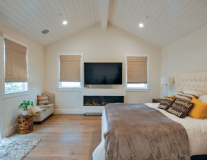 Brown roman shades in bedroom windows.