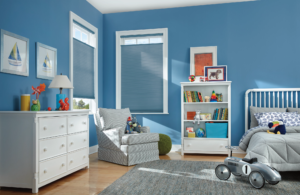 Honeycomb window shades in child's bedroom