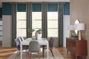 Green drapery and soft shades in dining room